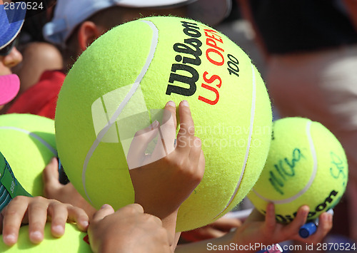 Image of Children with big tennis balls 