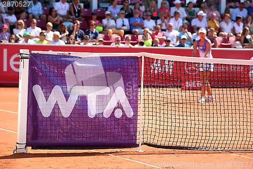 Image of wta-logo  on tennis net