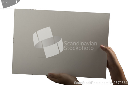Image of White Plastic laminate sign held up by hands