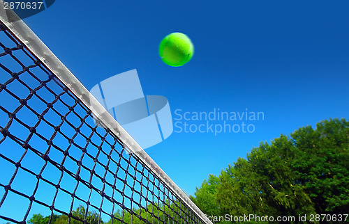 Image of Tennis ball on net´s edge