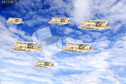 Image of dollars flying