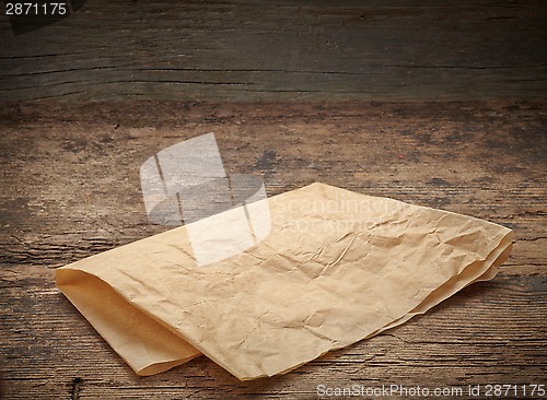 Image of brown wrapping paper on wooden table