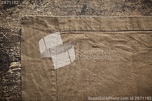 Image of linen napkin on wooden table