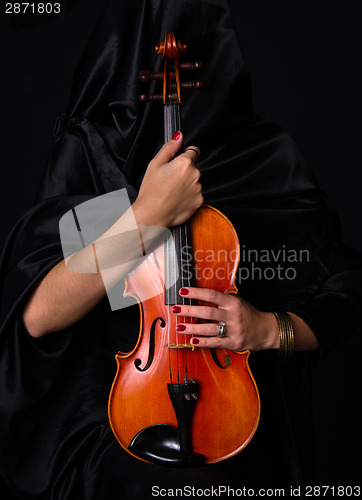 Image of Female Violinist Holds Bow Across Saturated Musical Violin Acous