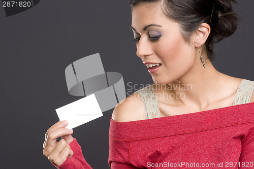 Image of Pretty Brunette Woman holding a business card