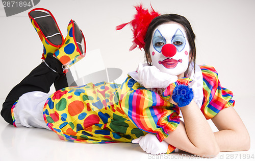 Image of Laying down female circus clown entertainment character