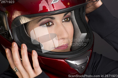 Image of Red Full Face Helmet and Female Motorcycle Rider