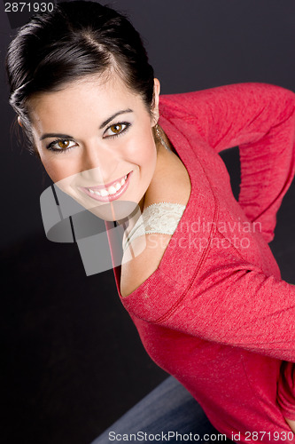 Image of Pretty Woman In Lace and Red Sweater On A Stool