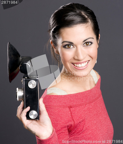 Image of Vintage Photographer Holding Camera With Flash Attached