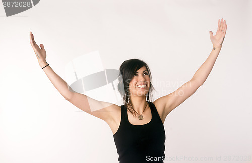 Image of Pretty Brunette Woman Holds Arms Outstretched Jubilant Looking U