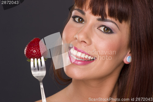 Image of Attractive Woman Holding a Strawberry