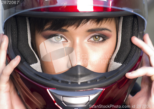 Image of Girl With Pretty Green Eyes in Red Full Face Helmet