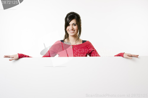 Image of Female Presenter Stands Above Blank White Board Smiling Woman