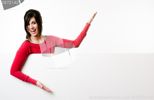 Image of Female Presenter Stands Above Blank White Board Smiling Woman