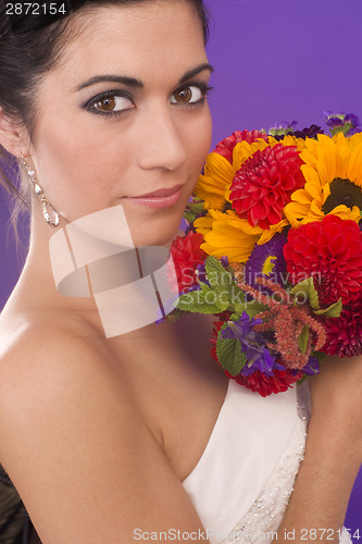 Image of Beautiful Vibrant Female in Bridal Gown with Flowers