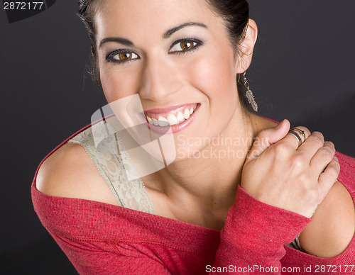 Image of Happy in Red Extreme Beauty Exudes From Brunette Female