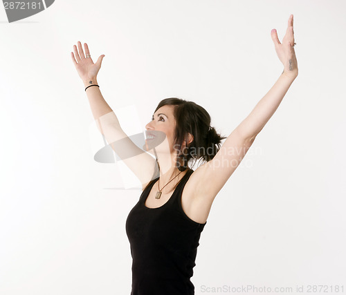 Image of Pretty Brunette Woman Holds Arms Outstretched Jubilant Looking U