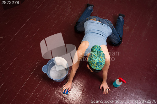 Image of Adorable Housewife Maid Doing Cleaning Chores Scrubbing Floor Ha