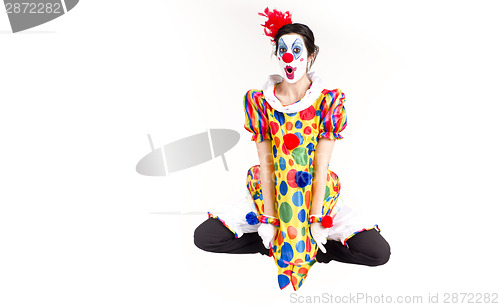 Image of Colorful Circus Clown Jumping Flying Mid-Air In Polka Dots