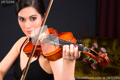 Image of Sensual Attractive Brunette Woman Playing Concert Acoustic Strin