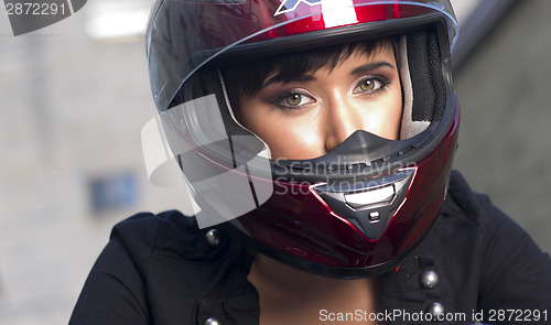 Image of Girl With Pretty Green Eyes in Red Full Face Helmet