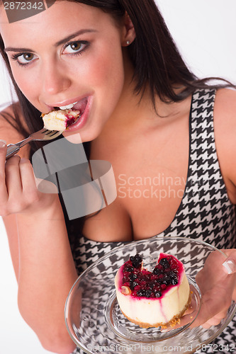 Image of Vertical Composition Attractive Brunette Woman Eating Sweet Dess