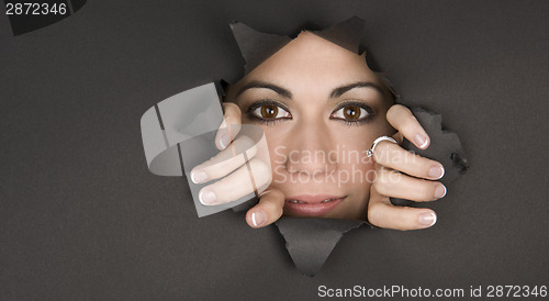 Image of Peek a Boo Look Woman Breaks Through Black Hole