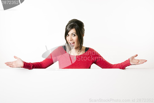 Image of Female Presenter Stands Above Blank White Board Smiling Woman