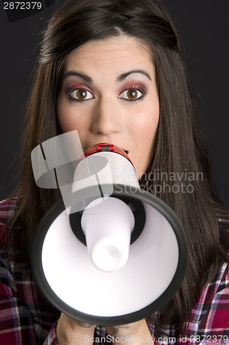 Image of Pretty Hawker Female Speaks into Megaphone Wide Eyes