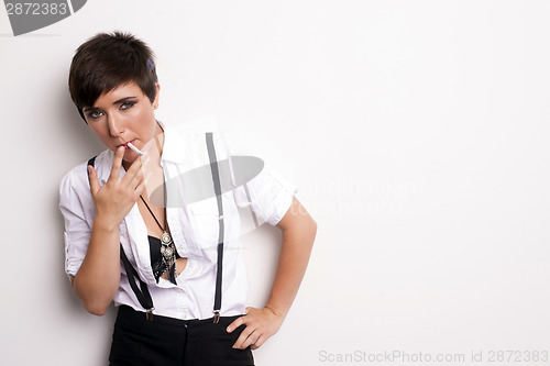 Image of Young Androgynous Addicted Person Stands Smoking Cigarette White