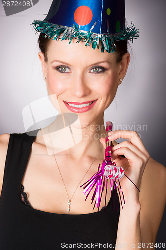 Image of Happy Celebration Attractive Adult Woman Noise Maker Party Hat