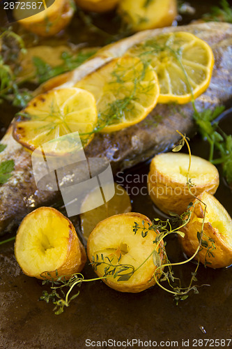 Image of Potatoes And Lemon On Trout Fillet