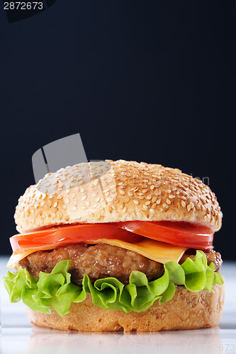 Image of Cheeseburger with tomatoes and lettuce