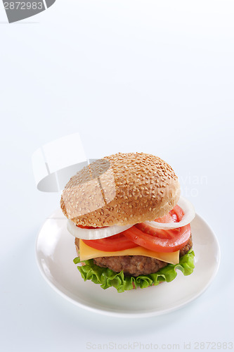 Image of Cheeseburger with tomatoes and lettuce