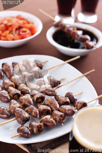 Image of Grilled chicken hearts on skewers