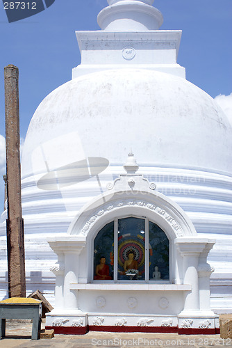 Image of Buddha in white stupa