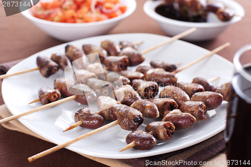 Image of Grilled chicken hearts on skewers