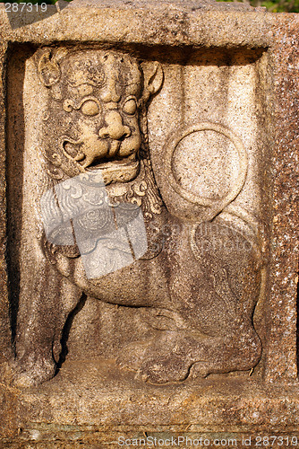 Image of Lion on the stone wa;;