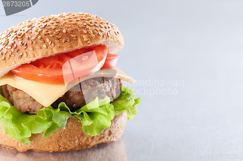 Image of Cheeseburger with tomatoes and lettuce