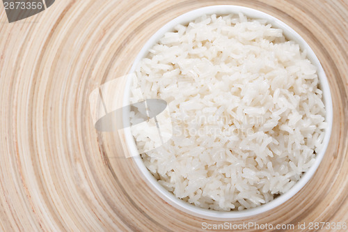 Image of Rice in a bowl on a bamboo plate