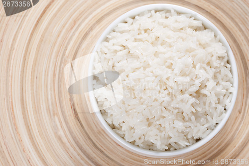 Image of Rice in a bowl on a bamboo plate