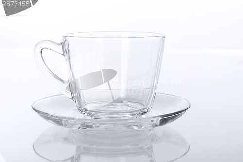 Image of Transparent glass cup and saucer