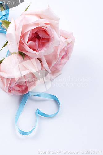 Image of Bouquet of roses with ribbon in heart shape