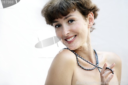 Image of Mature woman with a pearl necklace