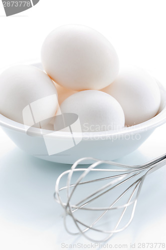 Image of Whisk and fresh eggs