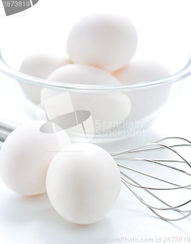 Image of Whisk and fresh eggs