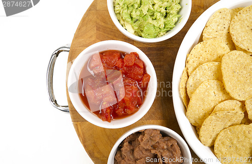Image of Food Appetizers Chips Salsa Refried Beans Guacamole Wood Cutting