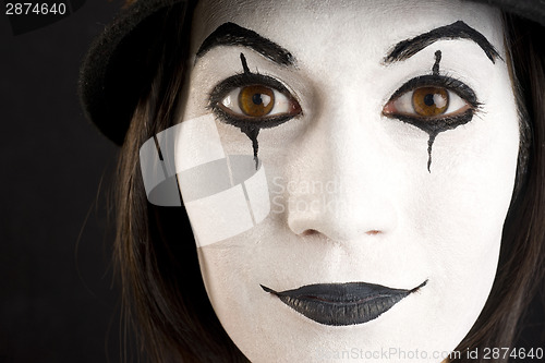 Image of Female in White Face Playing a Clown or Mime Close Up Portrait
