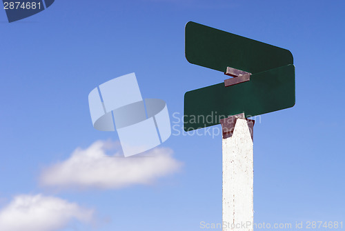 Image of Blank Signs Crossraods Street Avenue Sign Blue Skies Clouds