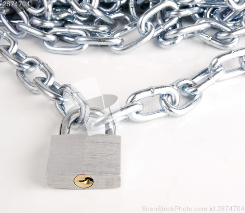 Image of Link Chain Connected By Keyed Steel Locking Padlock on White